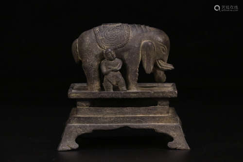 A BRONZE ORNAMENT OF PEACEFUL ELEPHANT