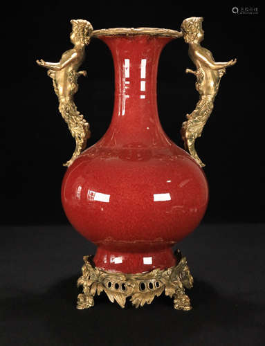 A RED GLAZED PORCELAIN VASE WITH GILT BRONZE DECORATED