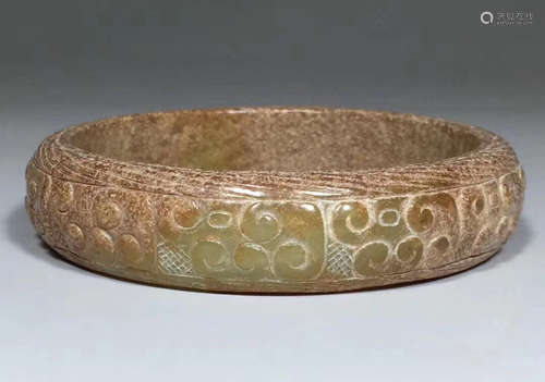 AN OLD HETIAN JADE BANGLE WITH DRAGON PATTERN