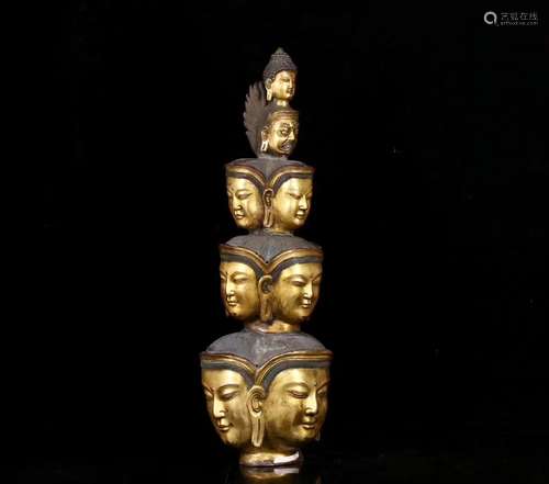 A GILT BRONZE MULTI BUDDHA FACE ORNAMENT