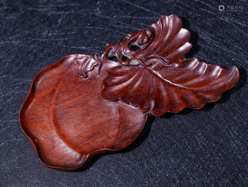 A HUALI WOOD CARVED LEAF PATTERN PEN TIAN