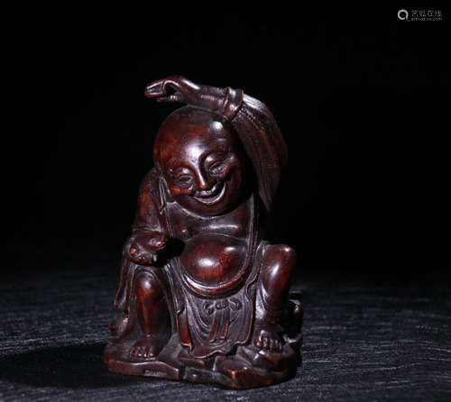 A CHENXIANG WOOD CARVED CHILD SHAPED PENDANT