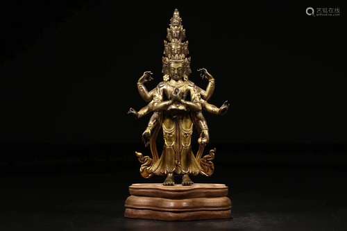 A GILT BRONZE CASTED MULTI ARM GUANYIN BUDDHA