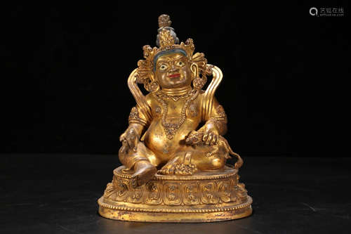 A TIBETAN GILT BRONZE CASTED WEALTH BUDDHA