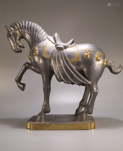 A TIN CARVED HORSE SHAPED ORNAMENT