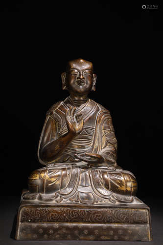 A GILT BRONZE CASTED GURU BUDDHA