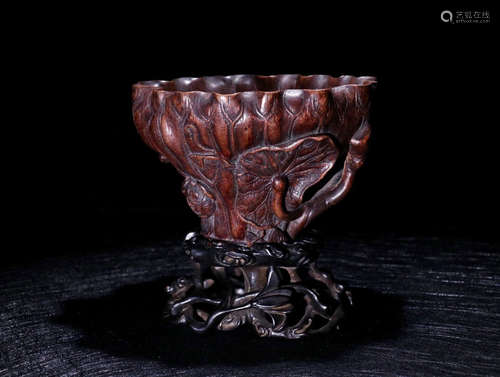 A CHENXIANG WOOD CARVED LOTUS PATTERN CUP