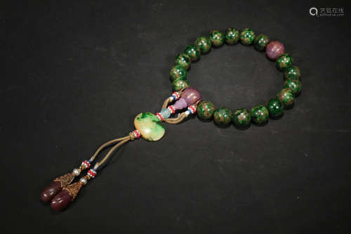 A JADEITE CARVED BEAD STRING BRACELET