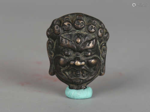 Bronze mask.