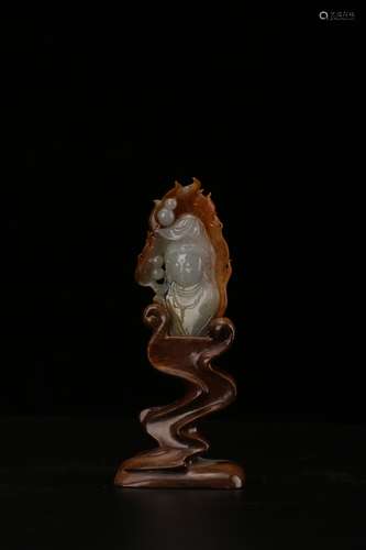 Chinese carved jadeite Guanyin on wood stand.