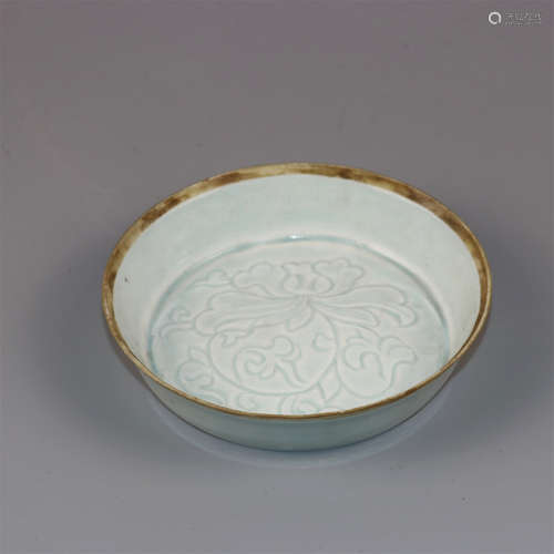 Chinese celadon glaze porcelain plate with floral decoration.