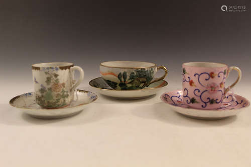 Three sets of Japanese porcelain cups and saucers.