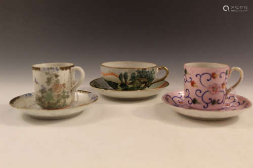 Three sets of Japanese porcelain cups and saucers.