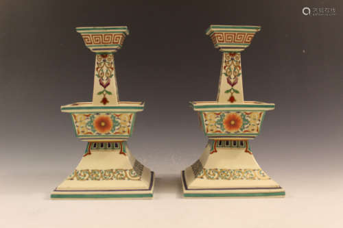 A pair of porcelain candle holders