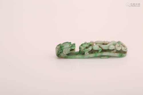 Chinese carved jade buckle with dragon decoration.