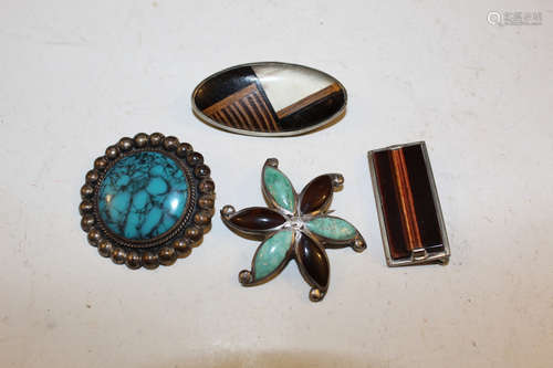 Four brooches.