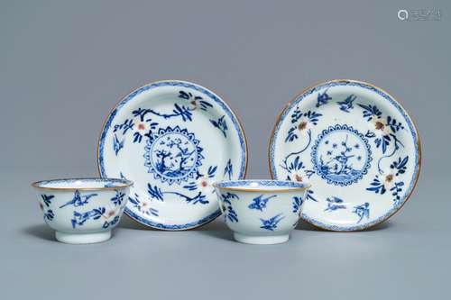 A pair of Chinese blue, white and underglaze red cups and saucers, Kangxi