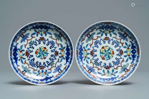 A pair of Chinese doucai plates with peaches, Qianlong mark, 19th C.