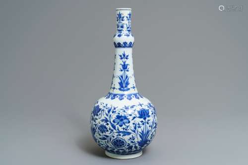 A Chinese blue and white bottle vase with floral design, Transitional period