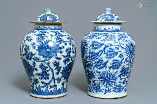 Two Chinese blue and white 'lotus scroll' vases and covers, Kangxi