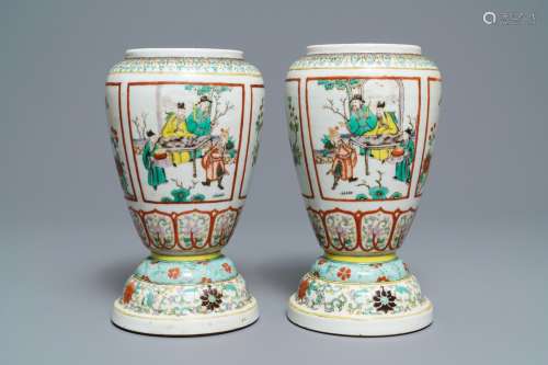 A pair of Chinese famille verte urns, 19th C.