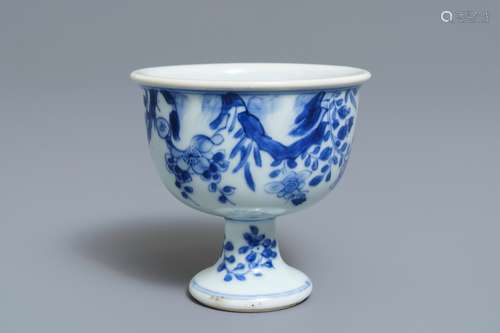 A Chinese blue and white stem cup with birds among blossoms, Transitional period