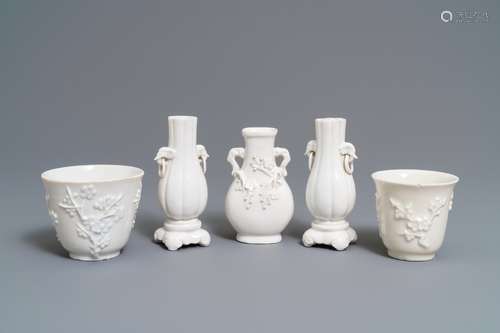 Three Chinese blanc de Chine vases and two cups with applied designs, Kangxi and later