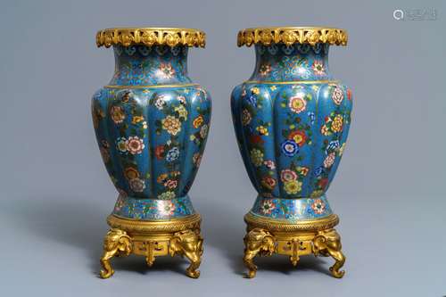 A pair of Chinese gilt bronze mounted cloisonné vases, 19th C.