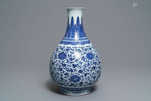 A Chinese blue and white 'peony scroll' bottle vase, Qianlong