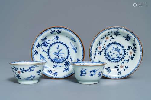 A pair of Chinese blue, white and underglaze red cups and saucers, Kangxi