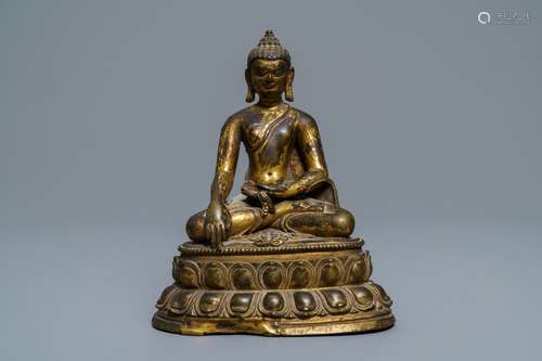 A gilt bronze figure of Buddha Shakyamuni, Tibet, 14/15th C.