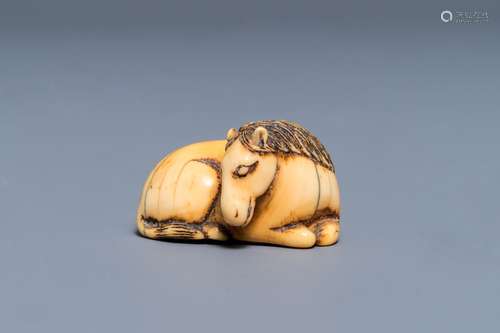 A Japanese ivory 'recumbent horse' netsuke, Edo, 18/19th C.