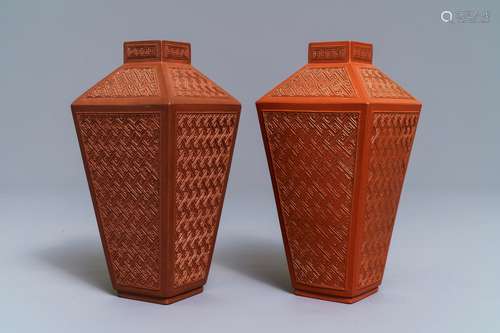 A pair of Chinese Yixing stoneware relief-decorated tea caddies, seal mark, 18th C.