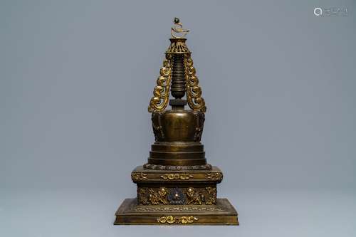 A large parcel-gilt inlaid bronze stupa, Tibet, 18th C.