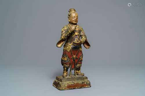 A large Chinese cold-painted bronze figure of a guardian, Ming