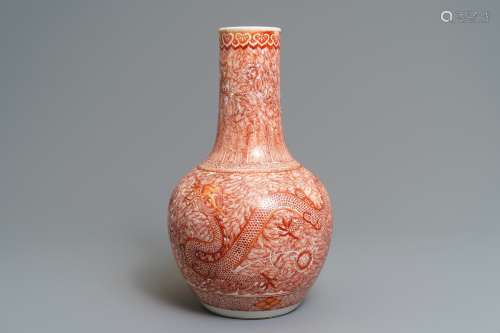 A Chinese iron red 'dragon and phoenix' bottle vase, 19th C.
