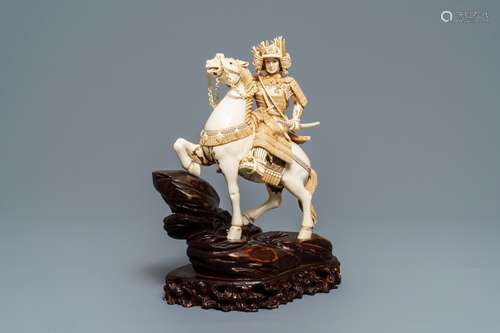 A Japanese ivory figure of a warrior on horseback, 1st half 20th C.