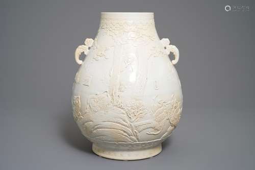 A Chinese monochrome cream-glazed relief-decorated hu vase, Qianlong mark, 20th C.