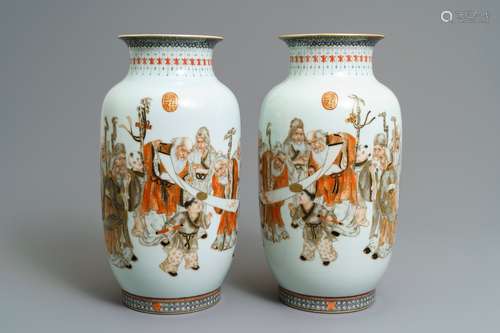 A pair of Chinese iron red, grisaille and gilt vases, Qianlong mark, 20th C.