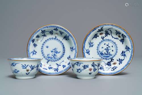 A pair of Chinese blue, white and underglaze red cups and saucers, Kangxi