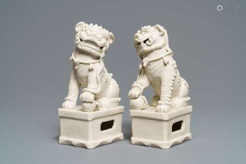 A pair of large Chinese Dehua blanc de Chine models of buddhist lions, Kangxi