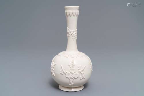 A Chinese Dehua blanc de Chine vase with applied floral designs, Kangxi