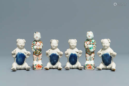 Four Chinese 'Tek Sing Cargo' biscuit boys and a pair of famille verte Hoho boys, Kangxi