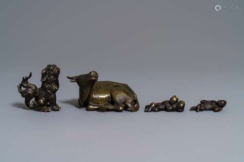 Four Chinese bronze scroll weights, 18/19th C.