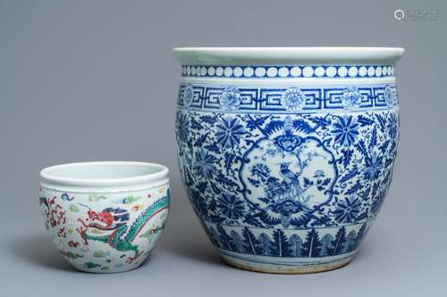 A Chinese blue and white fish bowl and a famille rose 'dragon' jardinière, 19th C. and Yongzheng