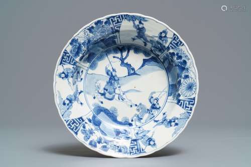 A Chinese blue and white deep plate with fighting warriors on horseback, Kangxi mark and of the period