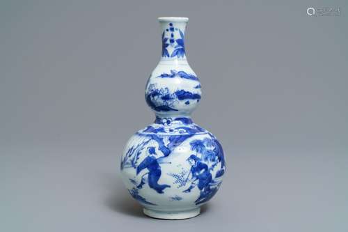 A Chinese blue and white double gourd vase, Transitional period