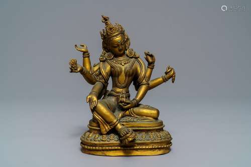 An inlaid gilt bronze figure of Vasudhara, Tibet or Nepal, 18/19th C.