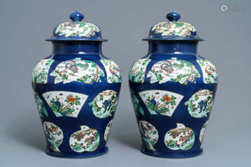 A pair of famille verte powder blue-ground vases and covers, Samson, Paris, 19th C.