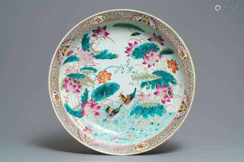 A massive Chinese famille rose 'ducks in a lotus pond' charger, Qianlong mark, 19th C.